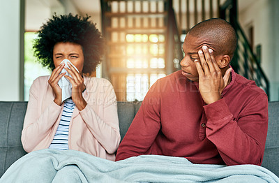 Buy stock photo Woman, sick and blowing nose with man on sofa for, allergies or flu with blanket for recovery. African couple, cloth and cleaning for virus, sneeze or rest with stress, thinking or headache in lounge