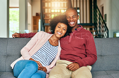 Buy stock photo Portrait of a young couple relaxing together at home