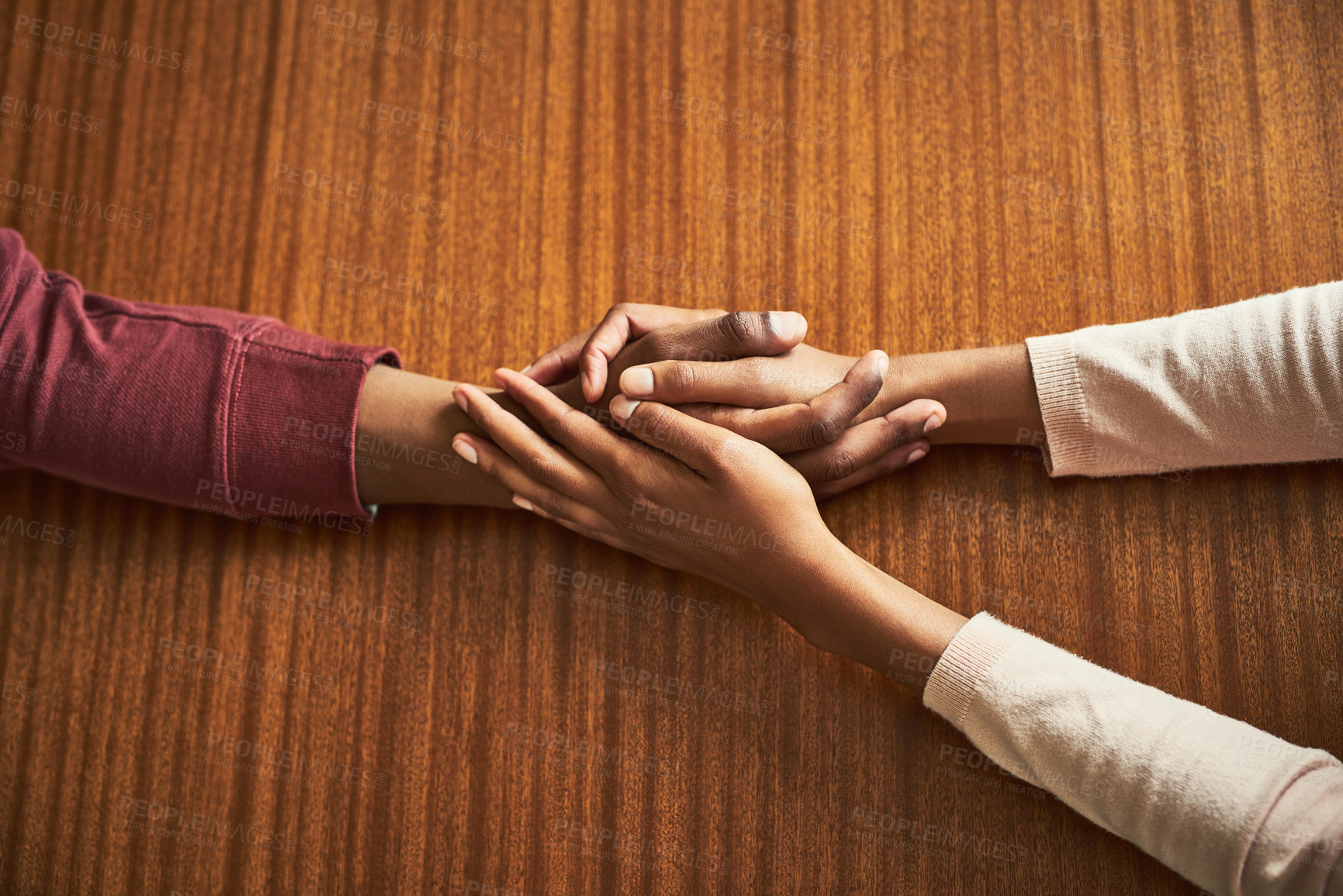 Buy stock photo Couple, holding hands and above for care in home with support, connection and empathy for mental health. People, comfort and partner for help with kindness, bonding and solidarity for grief on table