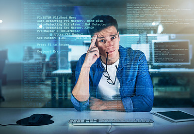 Buy stock photo Portrait of a focused young programmer working on his computer while contemplating in the office during the night