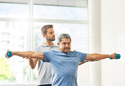 Buy stock photo Elderly man, fitness and dumbbell with physiotherapist for rehabilitation, wellness and muscle exercise. Senior person, workout and hand weight for management of pain, arthritis and anatomy health