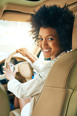 Buy stock photo Portrait of a cheerful young businesswoman driving in a car on her way to work during the day