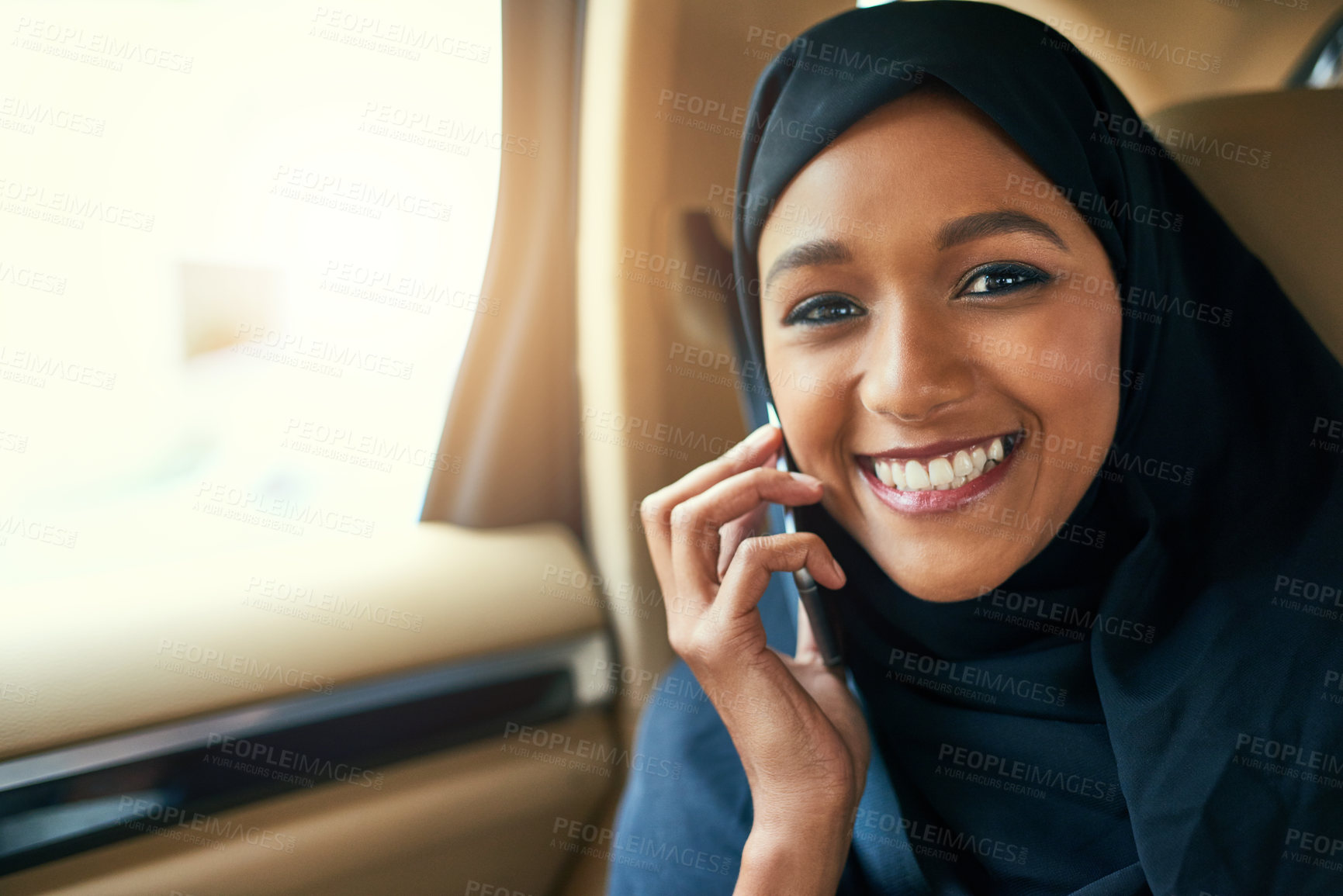 Buy stock photo Islamic, portrait or woman in car for travel, phone call or talking in discussion or taxi backseat on road. Ride, transportation or happy Muslim girl with cab service, mobile conversation or vehicle