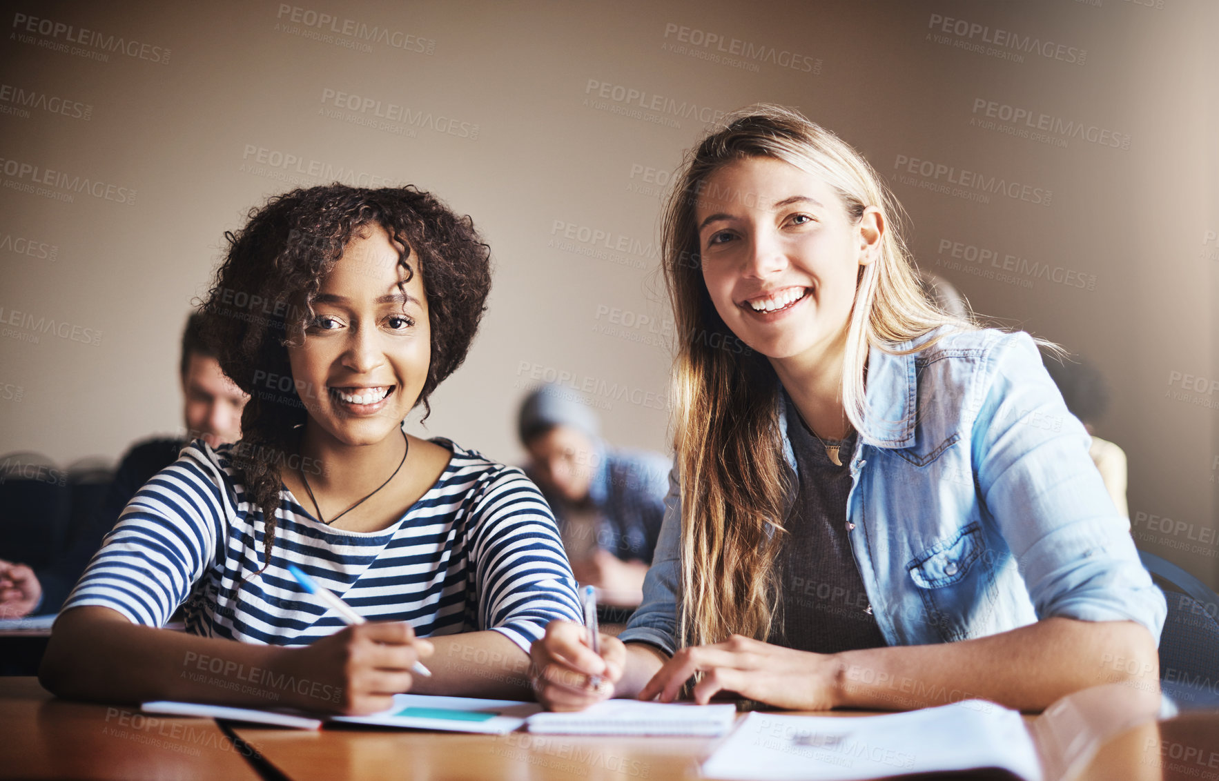 Buy stock photo Cropped shot of female university students in class