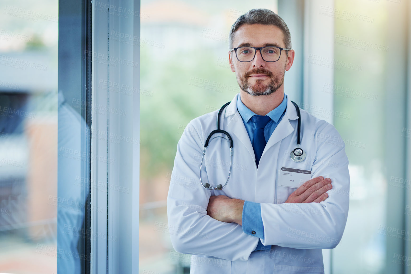 Buy stock photo Mature man, doctor and arms crossed for portrait in hospital, medical support and cardiologist. Male person, medicine and physician at hospital for consultation service, medicare and proud medicine