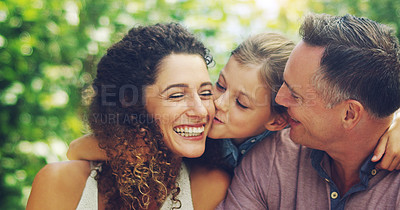 Buy stock photo Shot of an affectionate little girl spending quality time with her mother and father outdoors