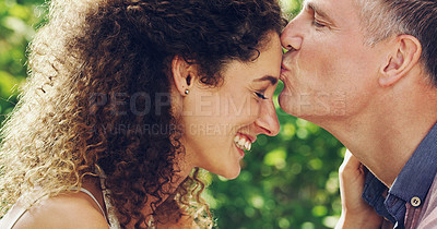 Buy stock photo Shot of a happy and affectionate mature couple spending quality time together outdoors