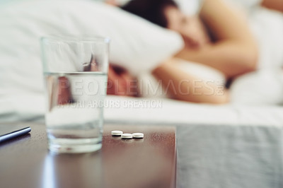 Buy stock photo Glass, water and pills for medicine in bedroom with couple sleeping, supplements and healthcare vitamins. Tired, people and aqua liquid for insomnia, hydrate and prescription drugs of health at house