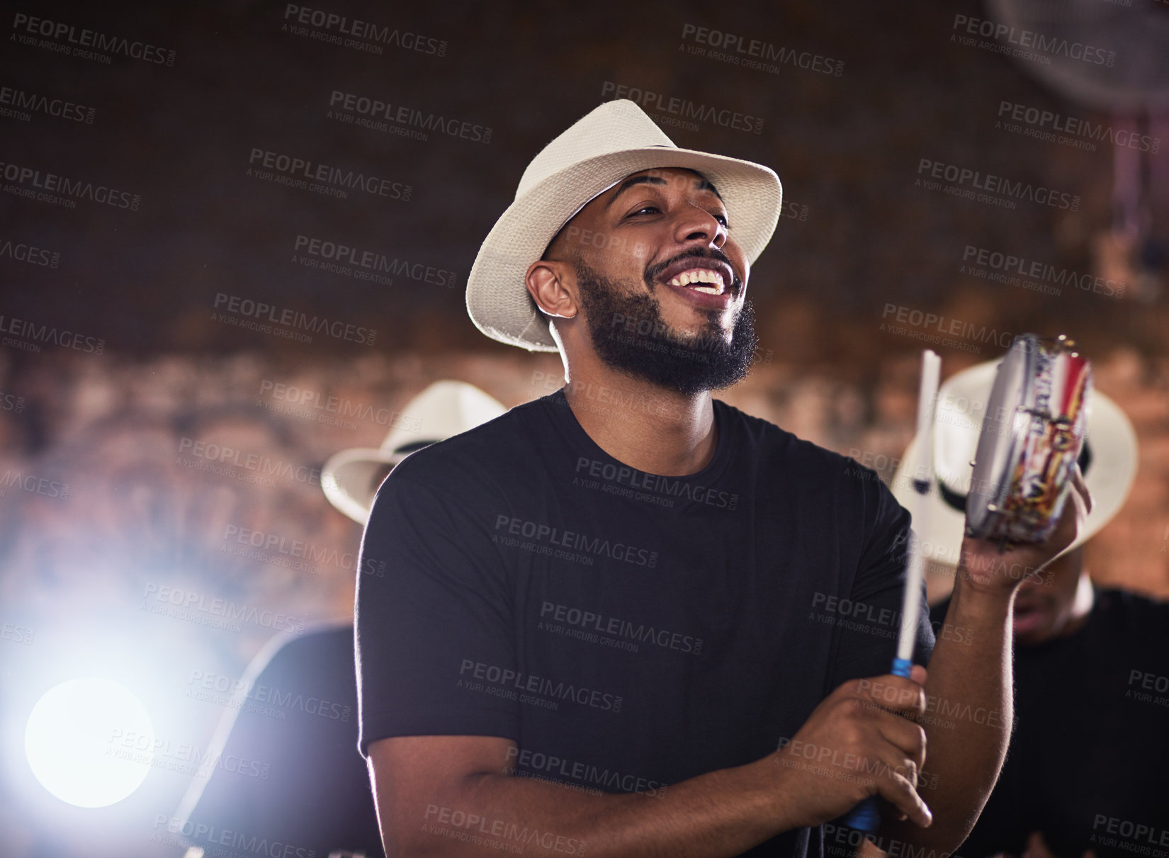Buy stock photo Shot of a young musician performing with his band