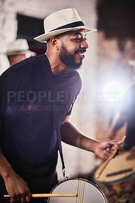 Buy stock photo Shot of a young musician performing with his band