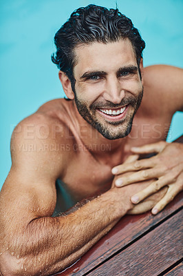 Buy stock photo Portrait of a handsome young man in the swimming pool at home