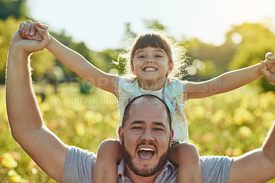 Buy stock photo Shot of an adorable little girl and her father playing together in the park