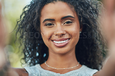Buy stock photo Shot of an attractive young woman taking a selfie in the city