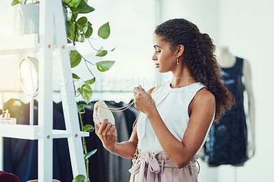 Buy stock photo Shot of an attractive young woman on a shopping spree in a boutique