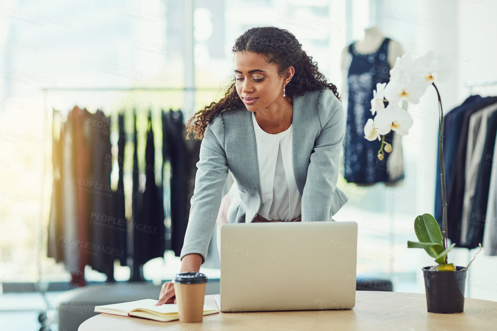 Buy stock photo Woman, laptop and fashion at boutique with book, notes and check schedule for reminder, sales or order. Person, computer and small business owner with notebook, review or ideas in luxury shop at mall