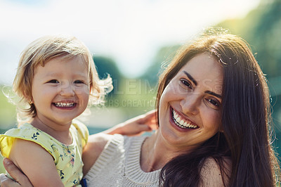 Buy stock photo Portrait of a mother bonding with her little daughter outdoors