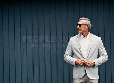 Buy stock photo Businessman, glasses and fashion at wall with space, confidence and thinking with style. Male professional, mature or career in finance, designer suit or corporate job in investing with clothes