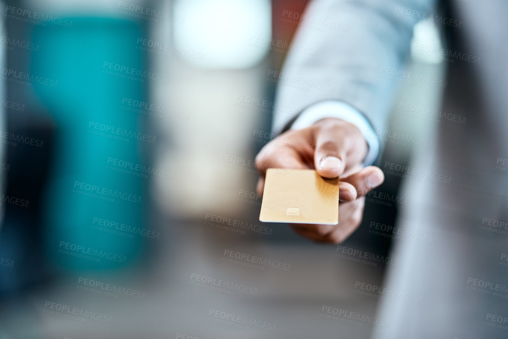 Buy stock photo Closeup shot of an unrecognizable businessman holding a credit card in an office