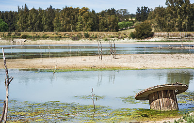 Buy stock photo Landscape, empty dam and outdoor with drought, natural disaster and climate change crisis in nature. Environment, countryside and dry lake for eco emergency, global warming or el nino in Portugal