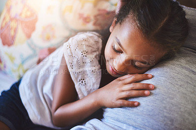 Buy stock photo Shot of an adorable little girl resting on her mother's pregnant stomach at home