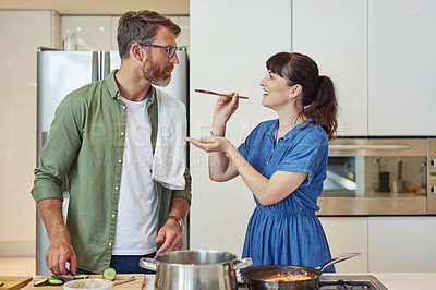 Buy stock photo Shot of a mature couple cooking together at home 