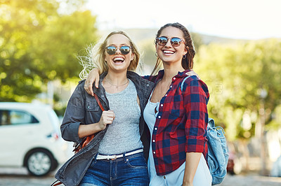 Buy stock photo Cropped shot of two beautiful female friends sight seeing in the city