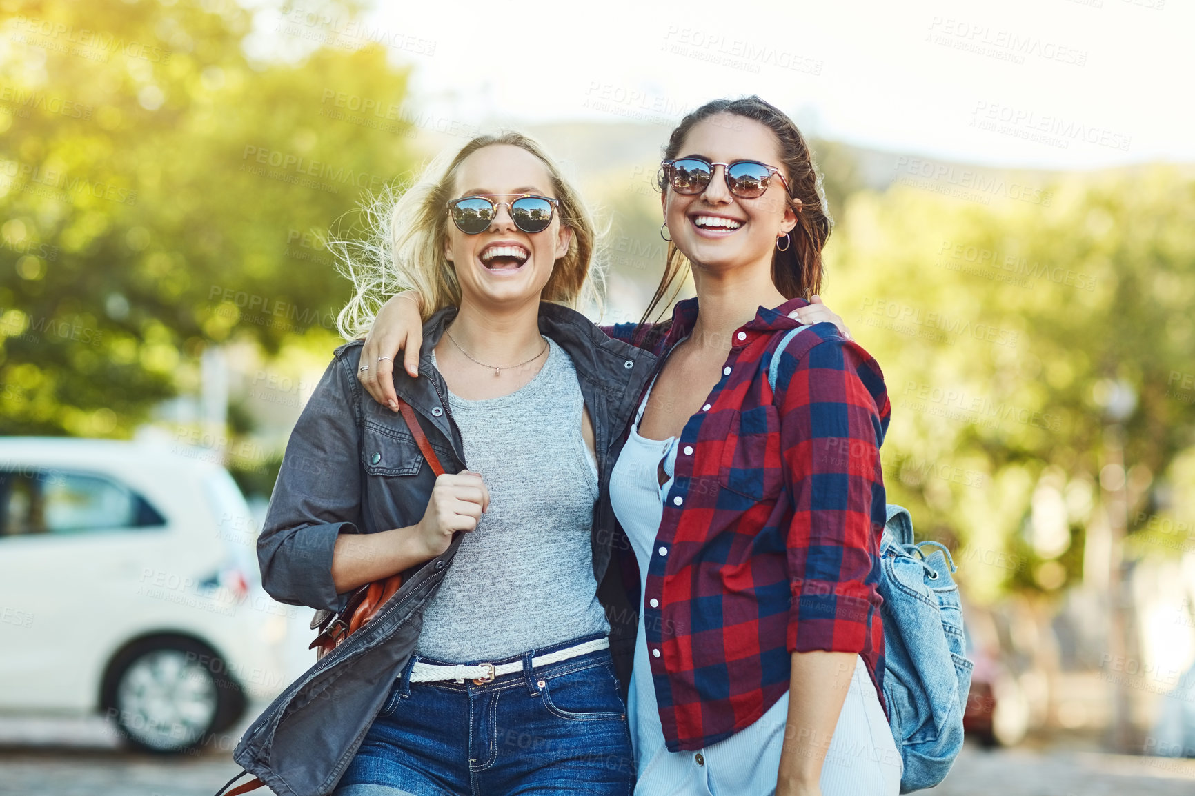 Buy stock photo Cropped shot of two beautiful female friends sight seeing in the city