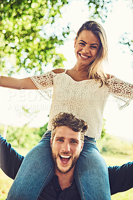 Buy stock photo Portrait of a young couple bonding together outdoors