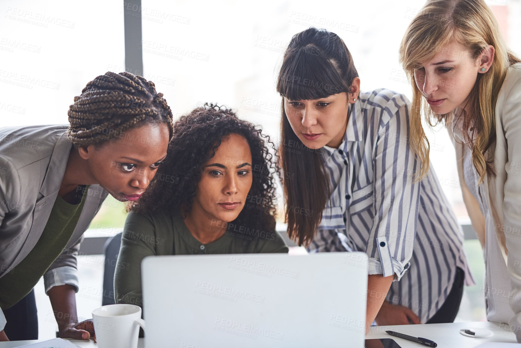 Buy stock photo Cropped shot of a group of businesswomen working in the office