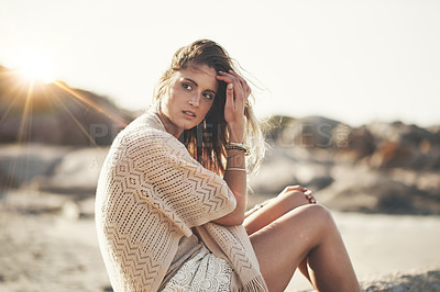 Buy stock photo Shot of an attractive young woman at the beach