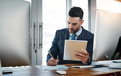 Buy stock photo Cropped shot of a handsome male executive working in a modern office