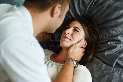 Buy stock photo Shot of young couple spending their day indoors