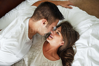 Buy stock photo Shot of young couple spending their day indoors