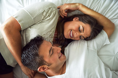 Buy stock photo Shot of young couple spending their day indoors