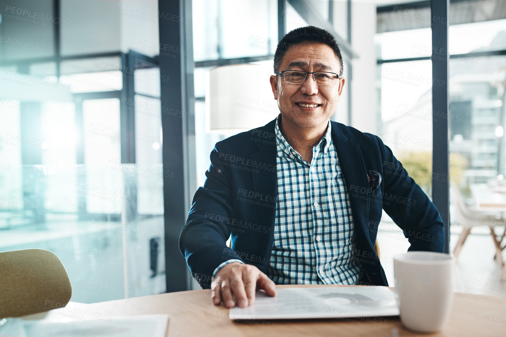 Buy stock photo Portrait, tablet and data with a business man in the office, sitting at a desk for planning or research. Happy, mindset and professional with a mature asian male manager working on his company vision