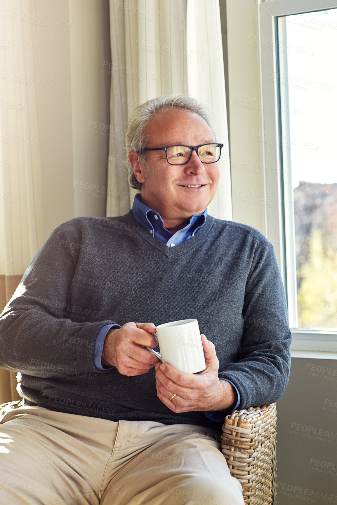 Buy stock photo Cropped shot of a senior man relaxing at home