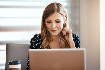 Buy stock photo Shot of a young businesswoman working in a modern office