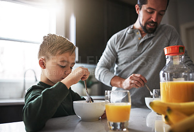 Buy stock photo Talking, breakfast and father with child in kitchen for nutrition, health and development. Happy, kid and bowl for cereal with orange juice for vitamins, conversation and wellness on weekend in home