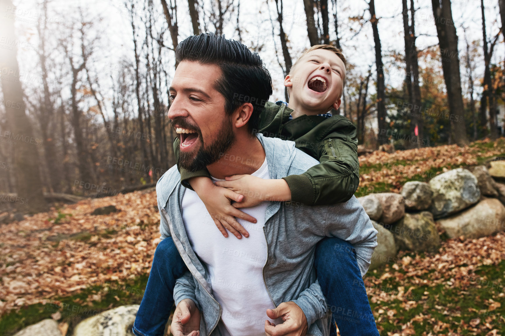 Buy stock photo Shot of a father and his little son  having fun outdoors