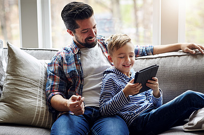 Buy stock photo Father, son and house on sofa with tablet, family together and browsing internet for kids shows or cartoon. Streaming, caring and weekend break or digital elearning app, apartment and relax in lounge