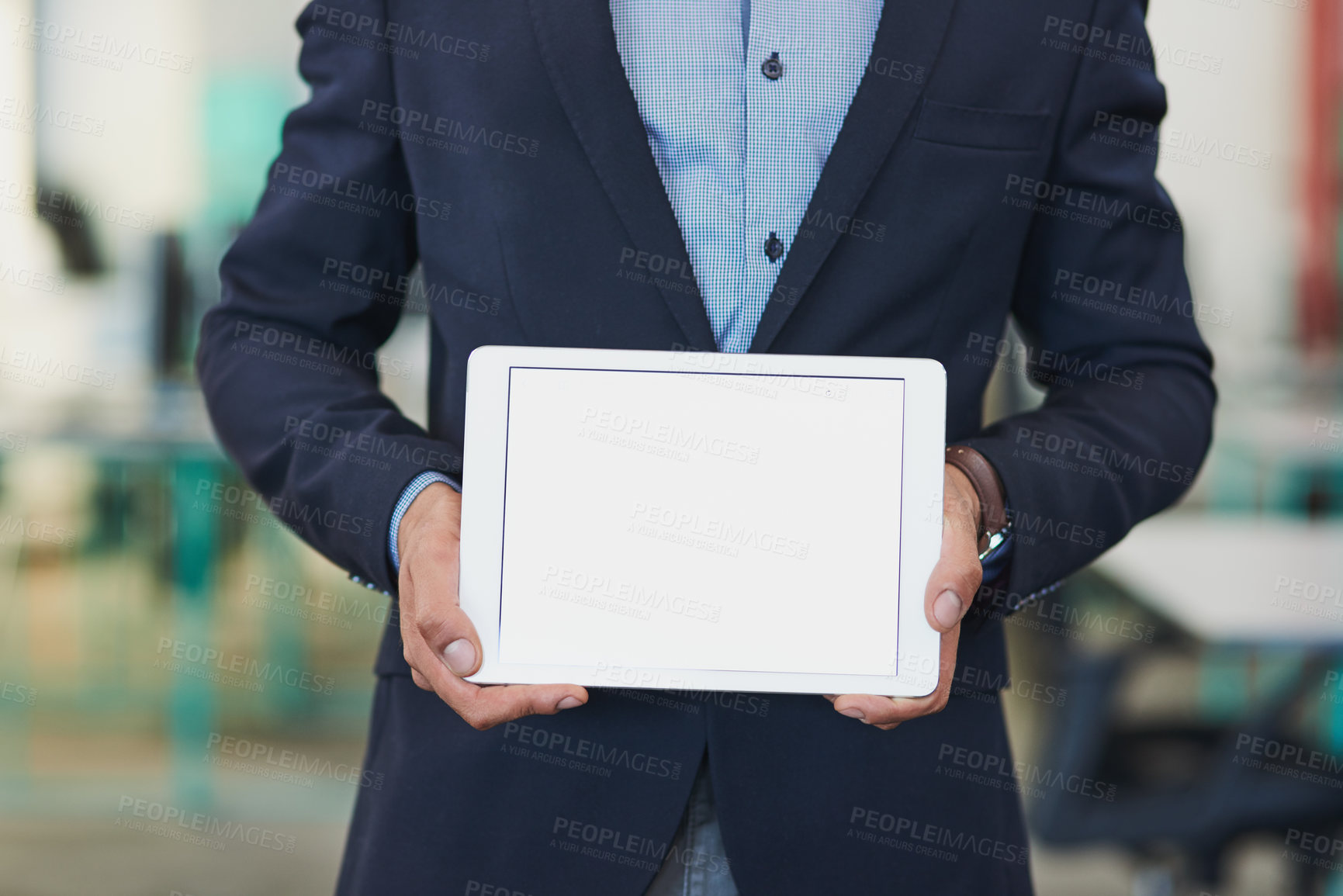 Buy stock photo Closeup shot of an unrecognizable businessman holding up a digital tablet with a blank screen in an office