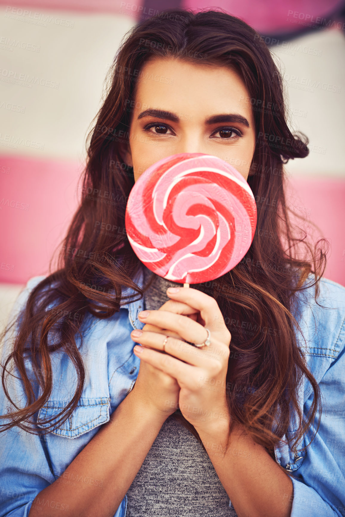 Buy stock photo Outdoor, woman and portrait with candy for fashion with street style, trendy clothes and swag in Spain. Female person, gen z and confidence with sweet for urban lifestyle, fun and relax for beauty