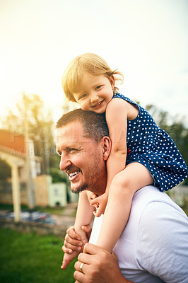 Buy stock photo Cropped shot of a father and his adorable daughter spending time together outside