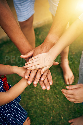 Buy stock photo Cropped shot of an unrecognizable father and his children joining hands in unity outside