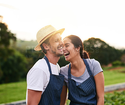 Buy stock photo Cropped shot of an affectionate young couple laughing while working on their privately owned farm