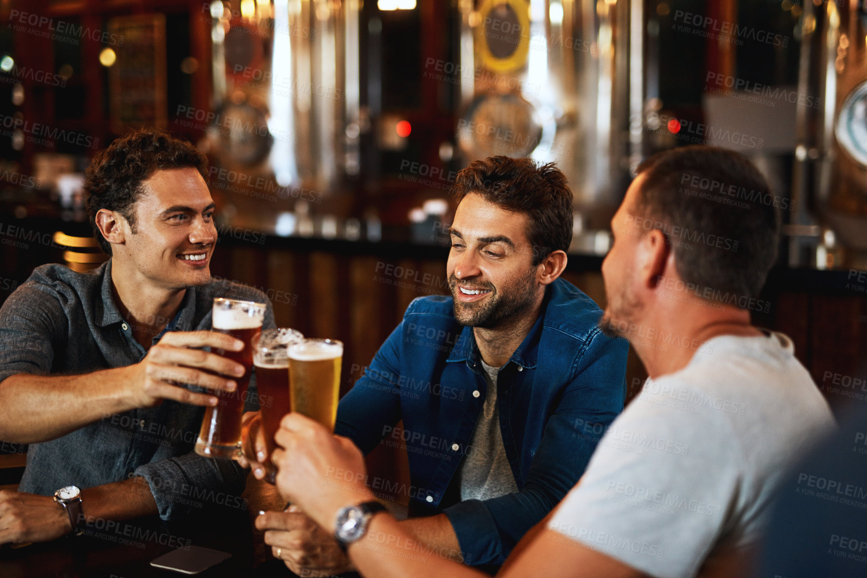 Buy stock photo Beer, cheers and men drinking with friends at social event in a restaurant with happiness. Alcohol, glasses and toast at a pub at happy hour with smile and conversation with drinks and celebration 