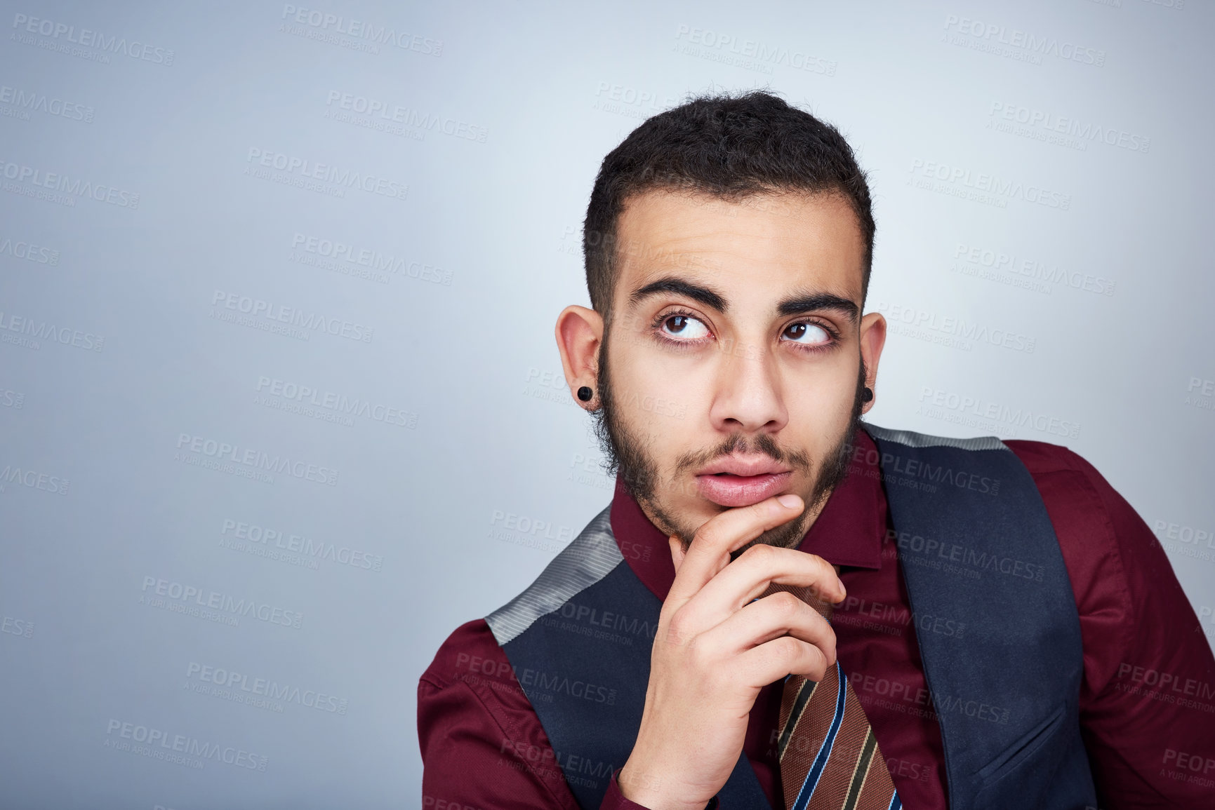 Buy stock photo Studio shot of a handsome young businessman posing against a grey background