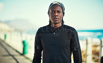 Buy stock photo Portrait of a sporty young man standing on the promenade