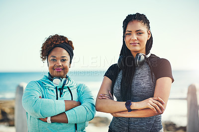 Buy stock photo Portrait of two sporty young women standing on the promenade