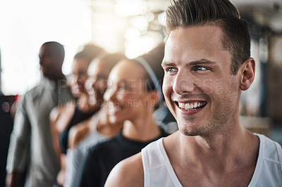 Buy stock photo Shot of a group of young people standing together in a line at the gym